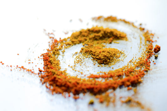 Spices in a circular motion which signifies progress and innovation.
