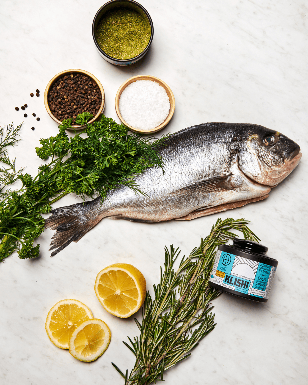 White fish with herbs and spices, lemon and klishi spice. 